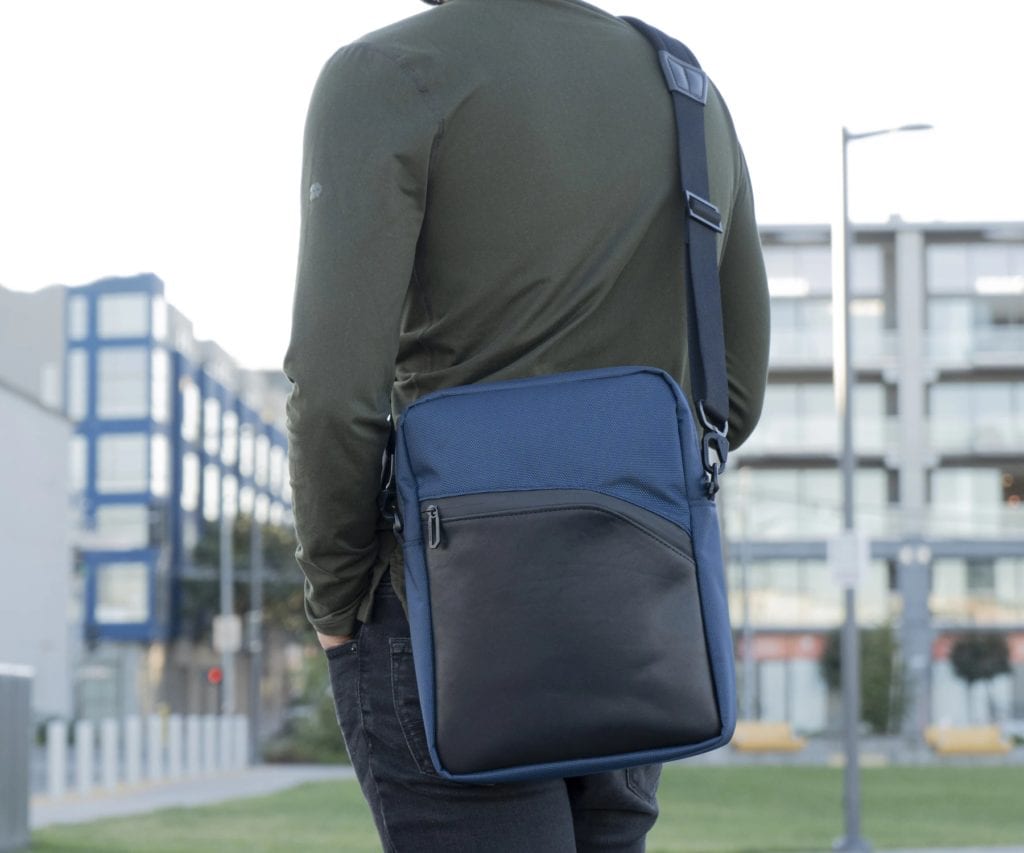 The Tall Zoom Crossbody Laptop Bag in Blue Italian Forza fabric with black leather accents.