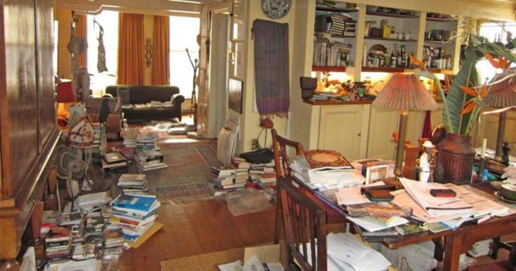 Image of cluttered home via DailyCaring.com